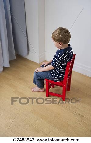 Stock Image - Young boy having a time out. Fotosearch