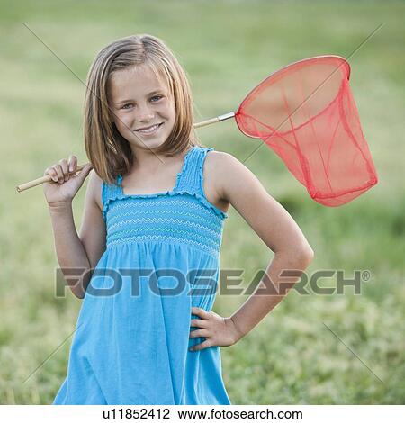 Young girl holding a butterfly net View Large Photo Image Stock Image - Young girl holding a butterfly net. Fotosearch
