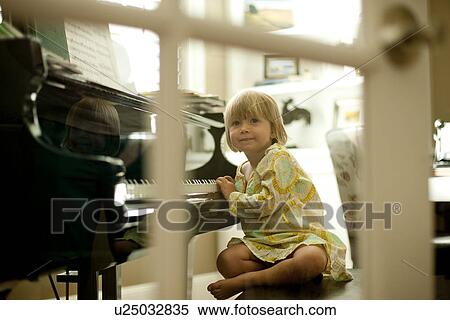 Young girl playing piano View Large Photo Image Stock Photography - Young girl playing piano. Fotosearch