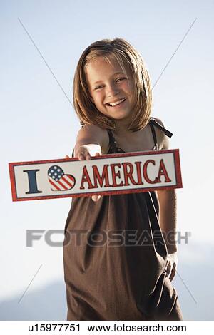 Stock Image - Young patriotic American girl. Fotosearch