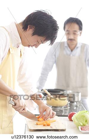 A family cooking View Large Photo Image Stock Image - A family cooking. Fotosearch
