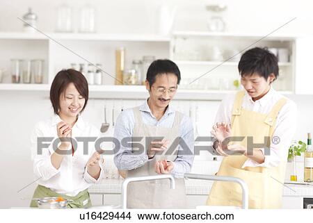 A family making hamburger stake View Large Photo Image Picture - A family making hamburger stake. Fotosearch