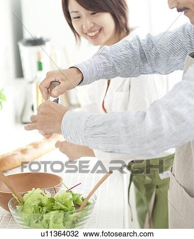 A family making salad View Large Photo Image Stock Image - A family making salad. Fotosearch
