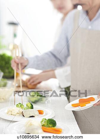 A family preparing meal View Large Photo Image Picture - A family preparing meal. Fotosearch