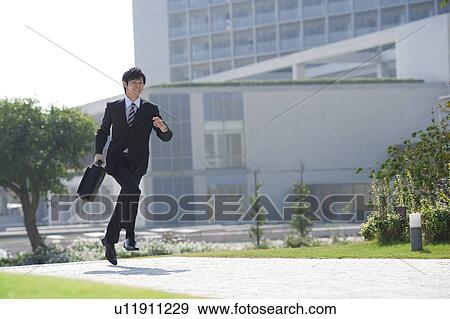 A running businessman View Large Photo Image Stock Photo - A running businessman. Fotosearch