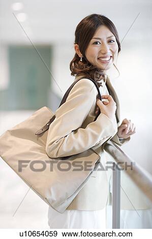 Stock Photo - A smiling business woman. Fotosearch