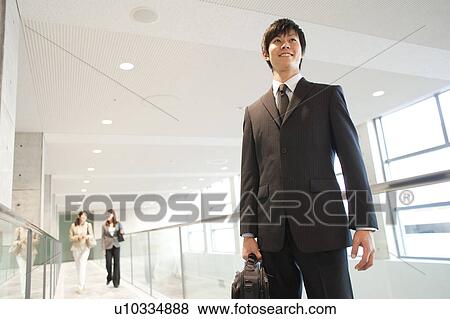 Stock Photo - A smiling businessman. Fotosearch