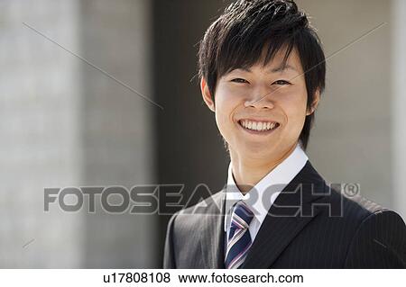 Stock Photo - A smiling businessman. Fotosearch