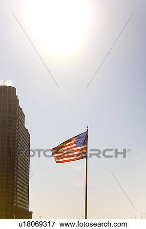 Stock Photo - American flag on a pole, Chicago, Illinois, USA. Fotosearch