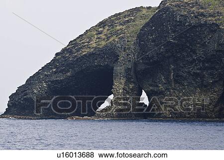 Arched rock formations in sea View Large Photo Image Stock Photo - Arched rock formations in sea. Fotosearch
