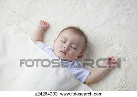 Stock Image - Baby Boy Sleeping. Fotosearch