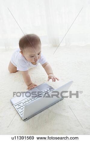 Baby Boy Using Laptop Computer View Large Photo Image Stock Photo - Baby Boy Using Laptop Computer. Fotosearch