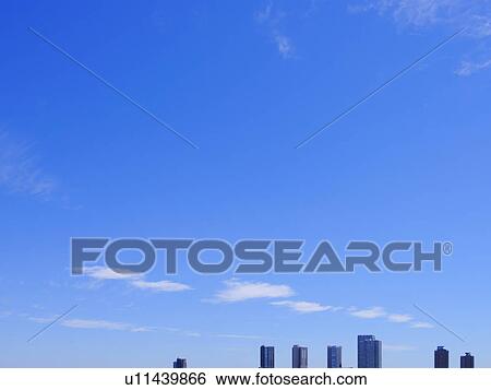 Stock Photograph - Blue Sky and Tall Buildings. Fotosearch