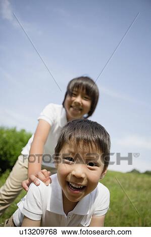Boy and Girl Having Fun Outdoors View Large Photo Image Stock Photo - Boy and Girl Having Fun Outdoors. Fotosearch
