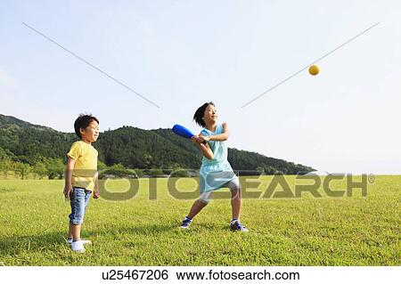 Stock Photograph - Boy and Girl Playing Softball. Fotosearch