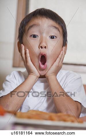 Picture - Boy looking surprised, Japan. Fotosearch