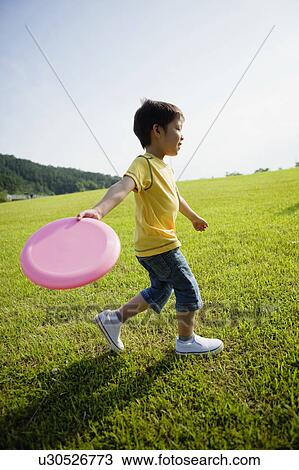 Boy Playing With Frisbee View Large Photo Image Stock Image - Boy Playing With Frisbee. Fotosearch