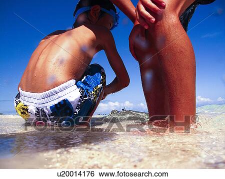 Stock Photograph - Boys at beach, Okinawa Prefecture, Japan. Fotosearch