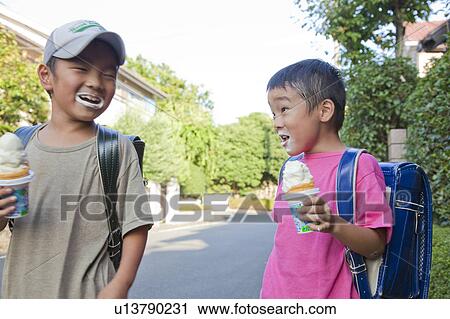 Boys eating ice cream, Japan View Large Photo Image Stock Image - Boys eating ice cream, Japan. Fotosearch