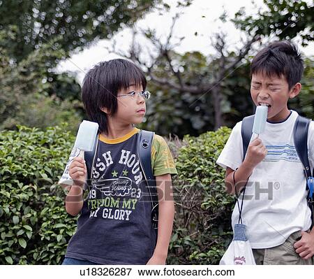 Boys eating popsicles, Japan View Large Photo Image Stock Photo - Boys eating popsicles, Japan. Fotosearch