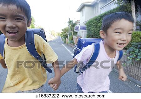 Boys holding hands and running, Tokyo Prefecture, Honshu, Japan View Large Photo Image Stock Image - Boys holding hands and running, Tokyo Prefecture, Honshu, Japan. Fotosearch