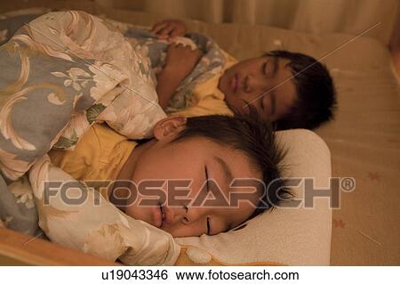 Boys sleeping in bed, Japan View Large Photo Image Stock Photograph - Boys sleeping in bed, Japan. Fotosearch