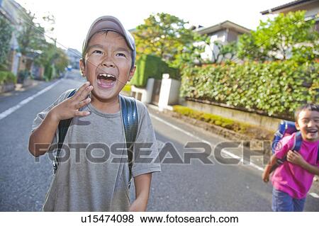 Stock Photo - Boys smiling, Tokyo Prefecture, Honshu, Japan. Fotosearch