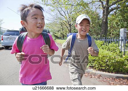 Boys walking, Tokyo Prefecture, Honshu, Japan View Large Photo Image Stock Photo - Boys walking, Tokyo Prefecture, Honshu, Japan. Fotosearch