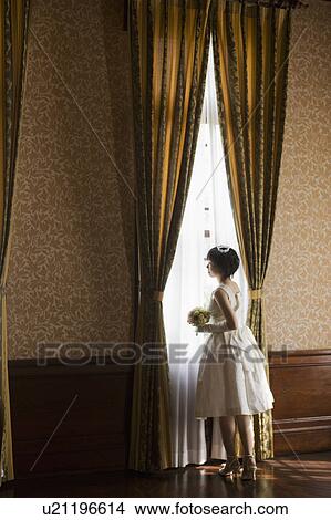 Picture - Bride Standing by Window. Fotosearch
