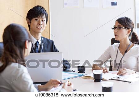 Business people having a meeting View Large Photo Image Stock Photography - Business people having a meeting. Fotosearch