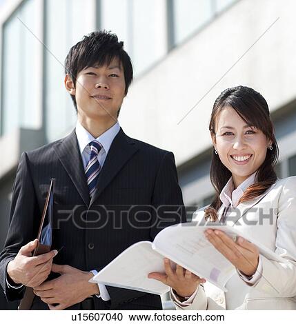 Stock Image - Business people smiling. Fotosearch