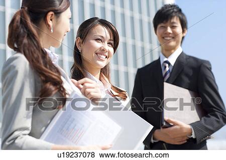 Stock Photo - Business people smiling. Fotosearch