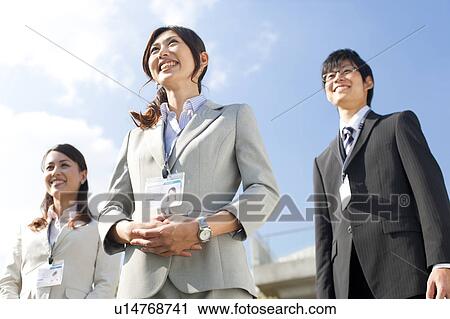 Stock Image - Business people standing. Fotosearch
