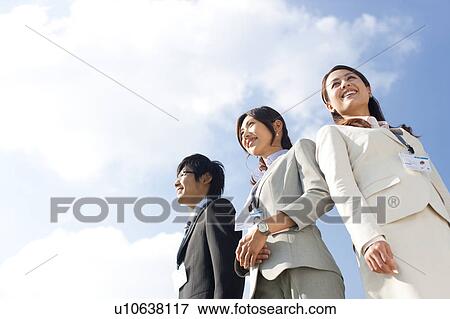 Stock Photo - Business people standing. Fotosearch