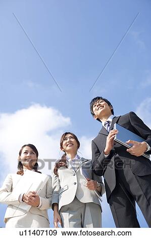 Business people standing View Large Photo Image Stock Photo - Business people standing. Fotosearch