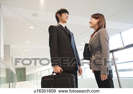 Business people talking View Large Photo Image Stock Photo - Business people talking. Fotosearch