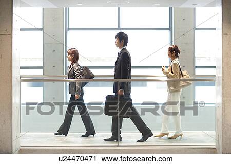 Stock Image - Business people walking. Fotosearch