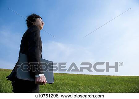 Businessman Walking in Field View Large Photo Image Stock Photograph - Businessman Walking in Field. Fotosearch