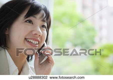 Stock Image - Businesswoman on the Phone. Fotosearch
