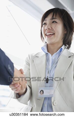 Picture - Businesswoman Shaking Hands. Fotosearch