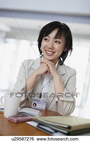 Businesswoman Sitting at Table View Large Photo Image Stock Photograph - Businesswoman Sitting at Table. Fotosearch