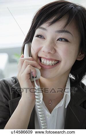 Stock Photo - Businesswoman Talking on the Phone. Fotosearch