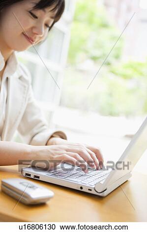 Stock Image - Businesswoman Typing. Fotosearch