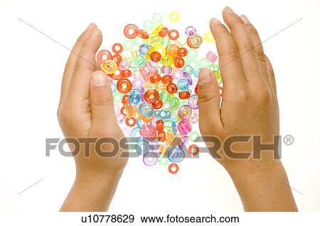 Child gathering beads View Large Photo Image Stock Photo - Child gathering beads. Fotosearch