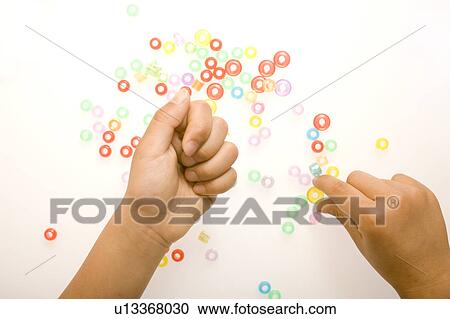 Child playing with beads View Large Photo Image Stock Image - Child playing with beads. Fotosearch