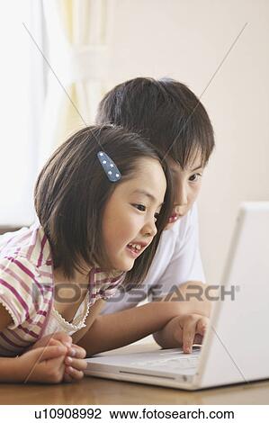 Children using laptop View Large Photo Image Stock Image - Children using laptop. Fotosearch