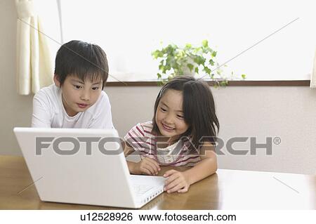 Children using laptop View Large Photo Image Stock Photograph - Children using laptop. Fotosearch