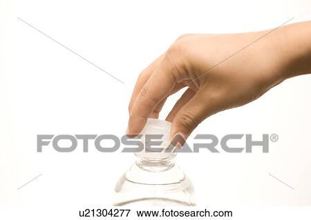 Stock Photo - Child's hand closing water bottle cap. Fotosearch