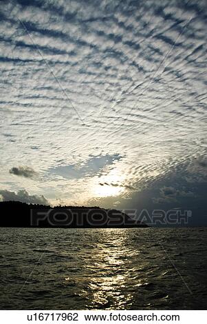 Stock Image - Cirrocumulus Over Ogawawara Islands. Fotosearch