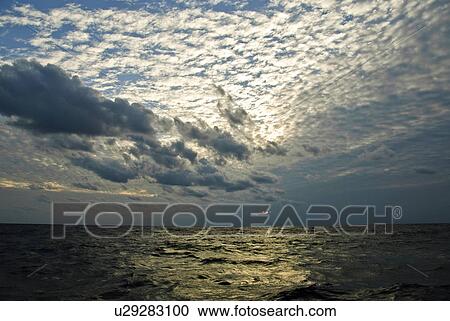 Stock Image - Cirrocumulus Over Ogawawara Islands. Fotosearch